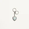 Coeur Hyperbole Bag Charm With Key Chain In Metal, Synthetic Material, And Crystals