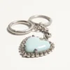 Coeur Hyperbole Bag Charm With Key Chain In Metal, Synthetic Material, And Crystals