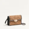 Valentino Garavani Rockstud small shoulder bag in pony-effect calfskin with animal print