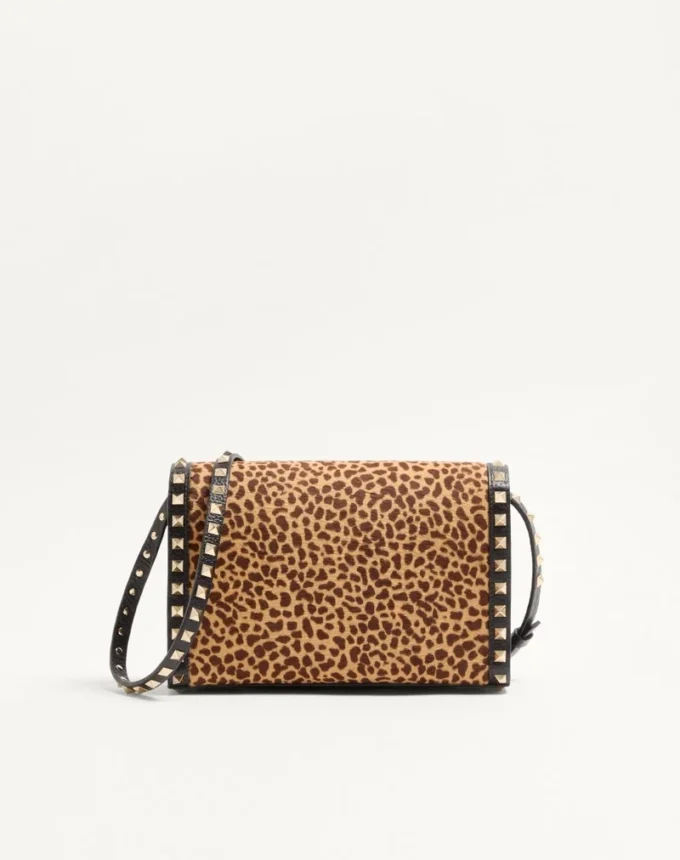 Valentino Garavani Rockstud small shoulder bag in pony-effect calfskin with animal print