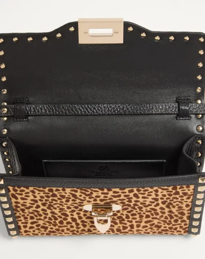Valentino Garavani Rockstud small shoulder bag in pony-effect calfskin with animal print