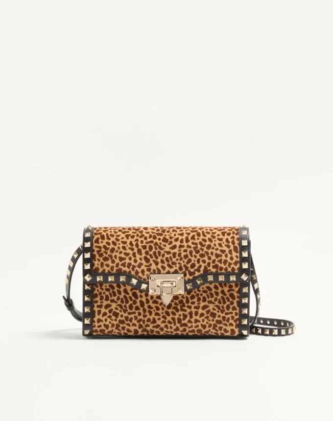 Valentino Garavani Rockstud small shoulder bag in pony-effect calfskin with animal print